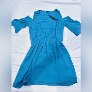 Revolve Krisa Blue Elastic-Waist Mini Dress with cold shoulder sleeves.